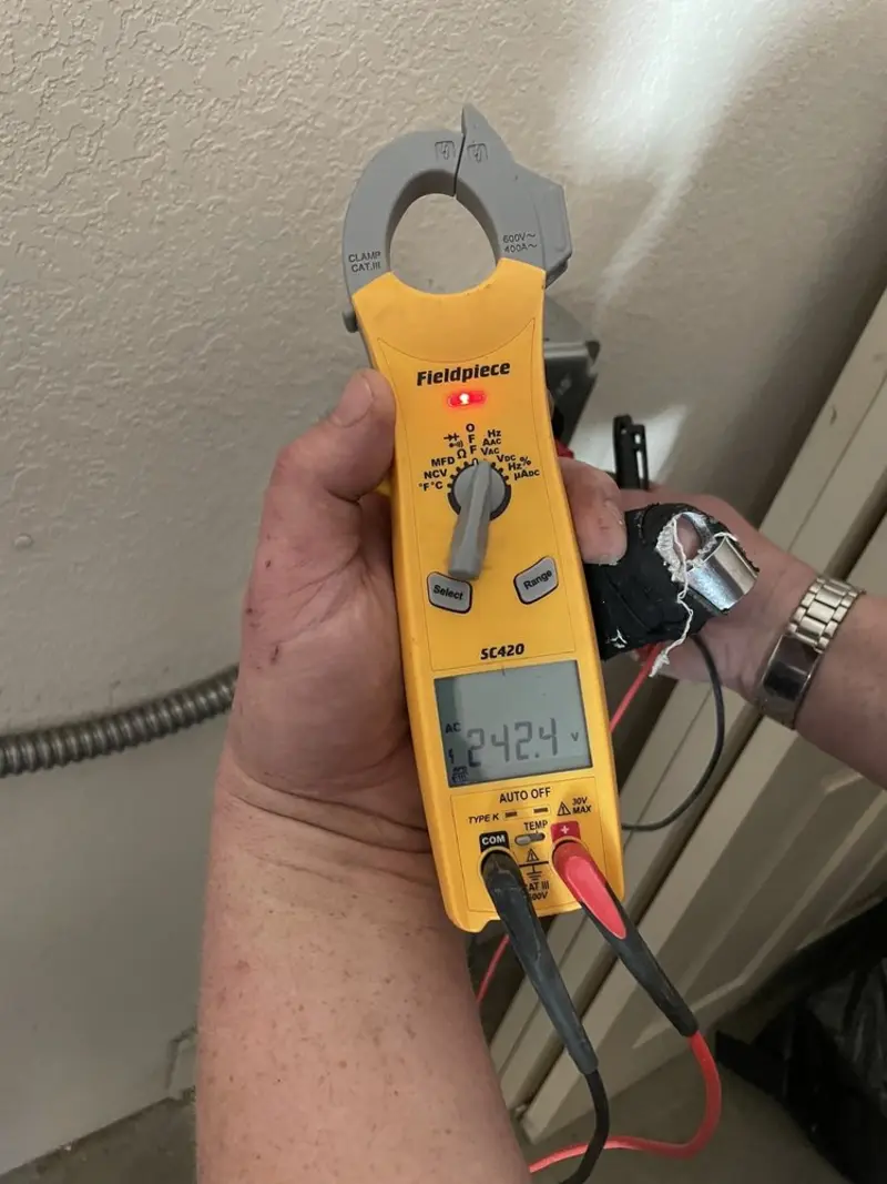 Voltage testing with clamp meter during Electrical Installation Services in Rialto